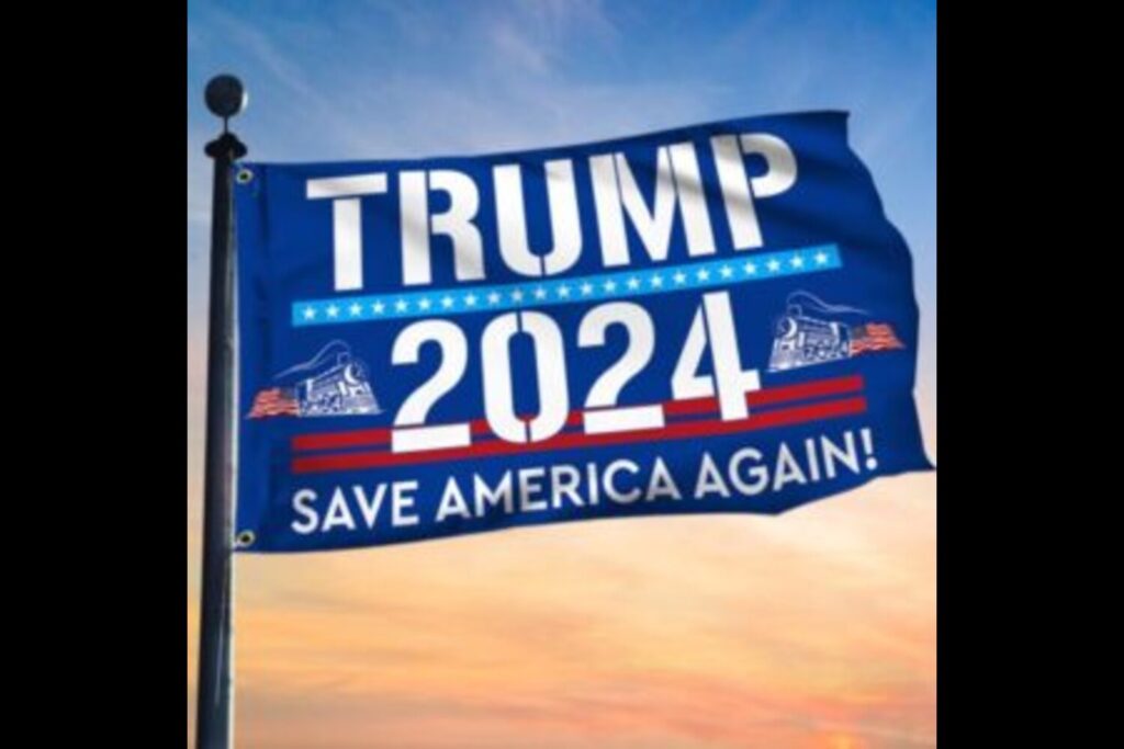 A close-up of a Trump 2024 flag, with the words "Trump 2024" in bold letters and an American flag in the background.