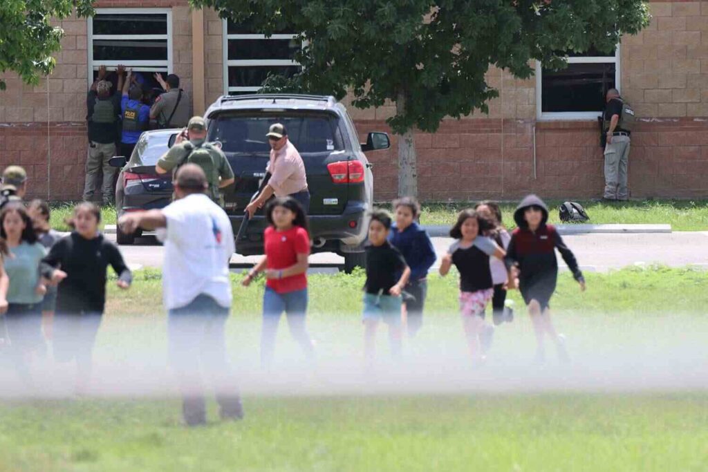 A photo of people gathered outside Allen Texas mall shooting in the Texas.